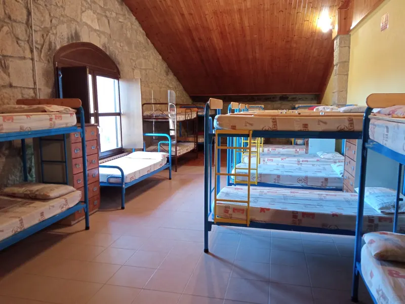 Habitació de les Golfes amb lliteres i bigues
